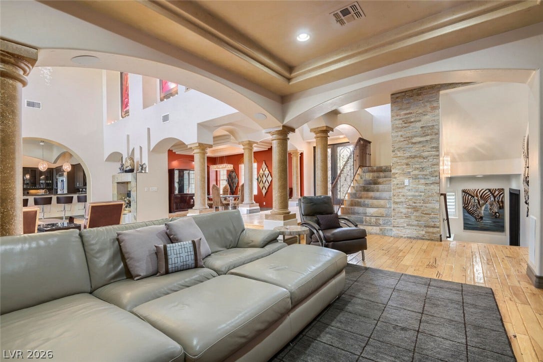 2010 Shenley Court, Las Vegas, NV 89117 Polished hardwood floors and stone accents highlight this grand open living space.