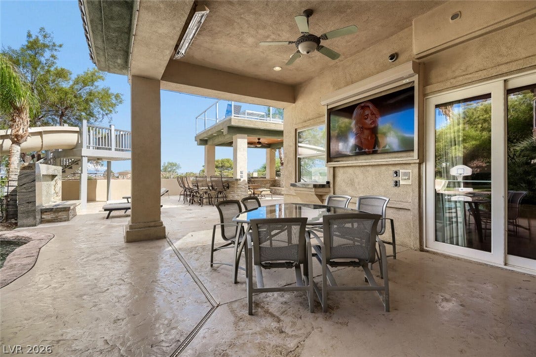 2010 Shenley Court, Las Vegas, NV 89117 A spacious covered patio with concrete flooring leads directly to the sunny pool deck.