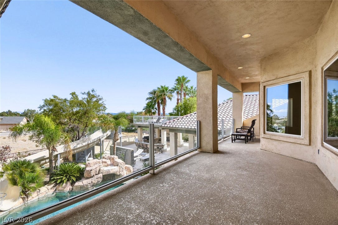 2010 Shenley Court, Las Vegas, NV 89117 An elevated covered balcony overlooks the private pool area below.
