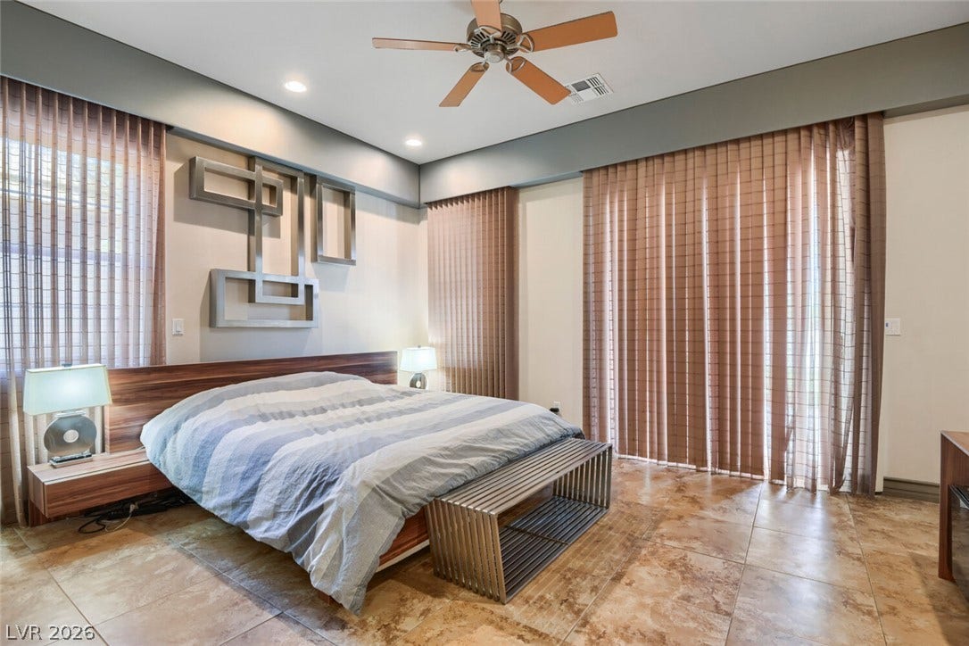 2010 Shenley Court, Las Vegas, NV 89117 High ceilings and warm tile flooring define this spacious modern bedroom suite.