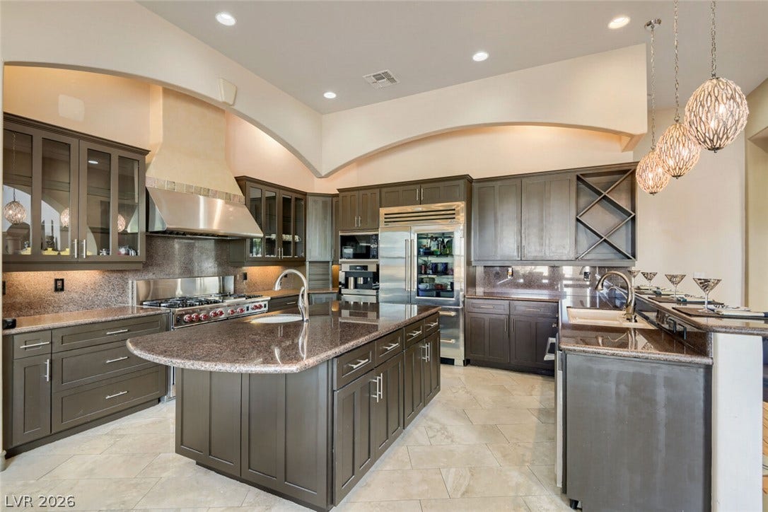2010 Shenley Court, Las Vegas, NV 89117 Gourmet kitchen features custom cabinetry, granite countertops, and an expansive central island.