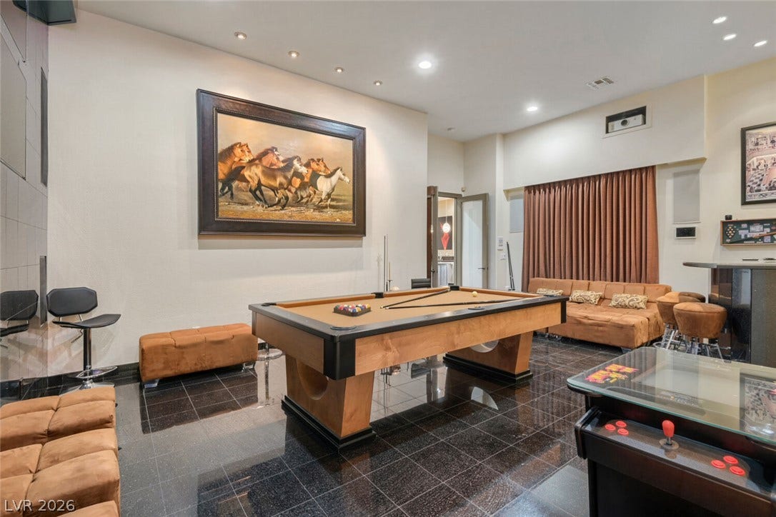 2010 Shenley Court, Las Vegas, NV 89117 Polished tile flooring and recessed lighting define this spacious recreational room.