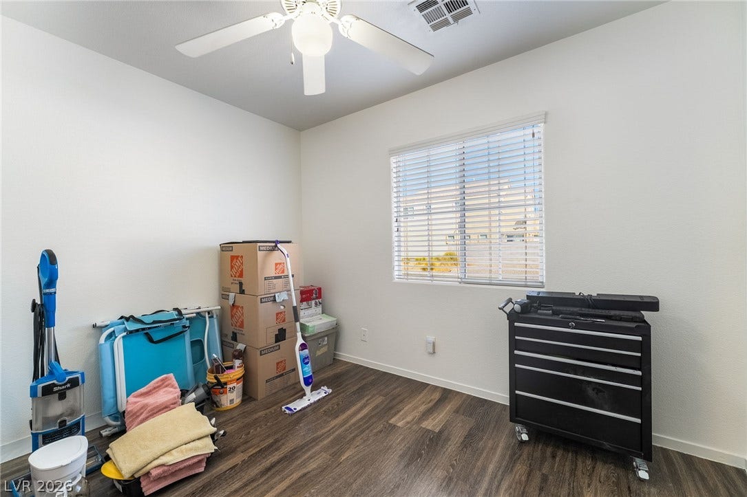 6275 Felicitas Avenue, Las Vegas, NV 89122 Gleaming wood flooring complements the neutral walls and natural light streaming through the window.