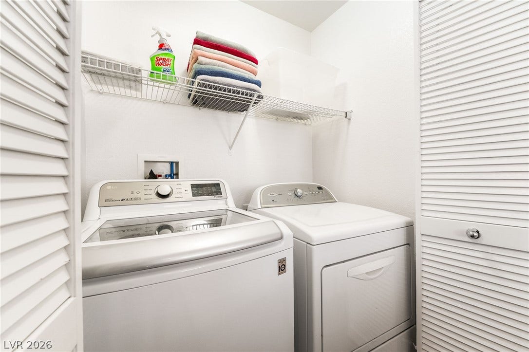6275 Felicitas Avenue, Las Vegas, NV 89122 An organized utility closet features a stacked shelf above the laundry appliances.