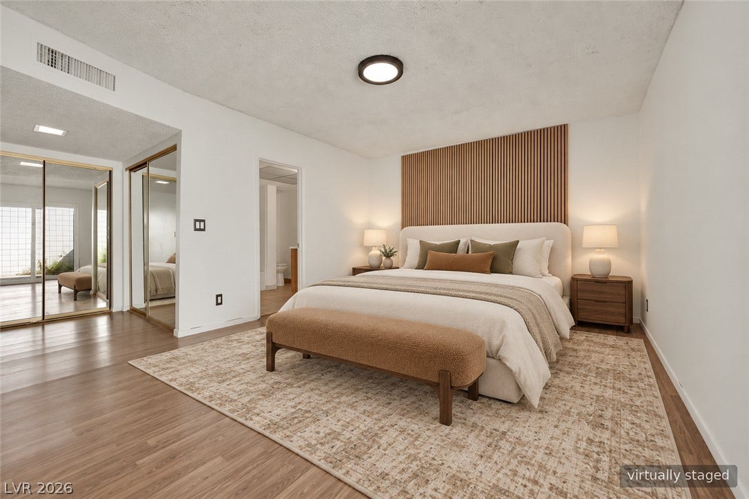 3753 Heritage Avenue, Las Vegas, NV 89121 Warm wood flooring and an integrated wooden headboard feature define this peaceful bedroom retreat.