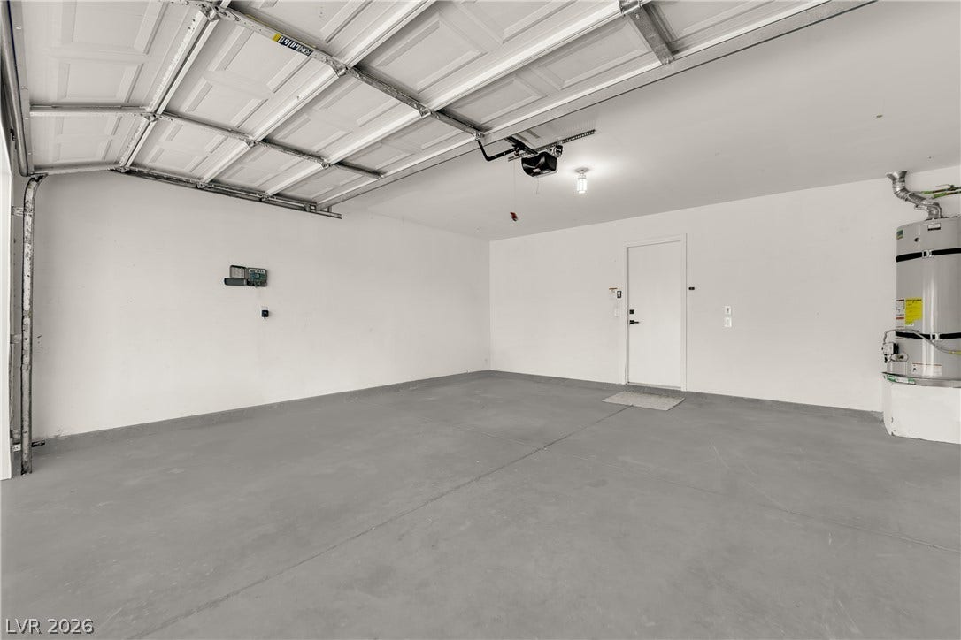 Smooth concrete floors and a clean layout define this functional multi-vehicle garage.