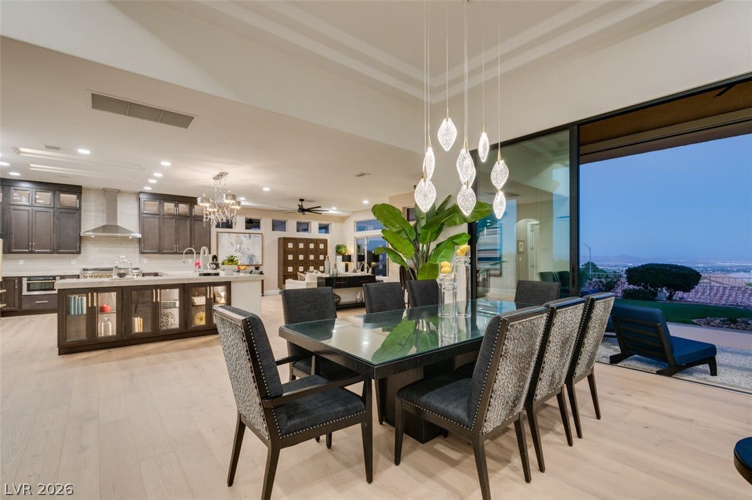 2532 Faiss Drive, Las Vegas, NV 89134 Gleaming wood floors and a soaring tray ceiling enhance this open-concept dining space.