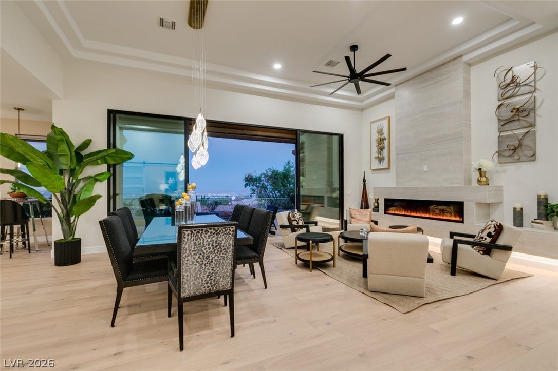2532 Faiss Drive, Las Vegas, NV 89134 Retracting glass doors open this main living space to expansive horizon views.
