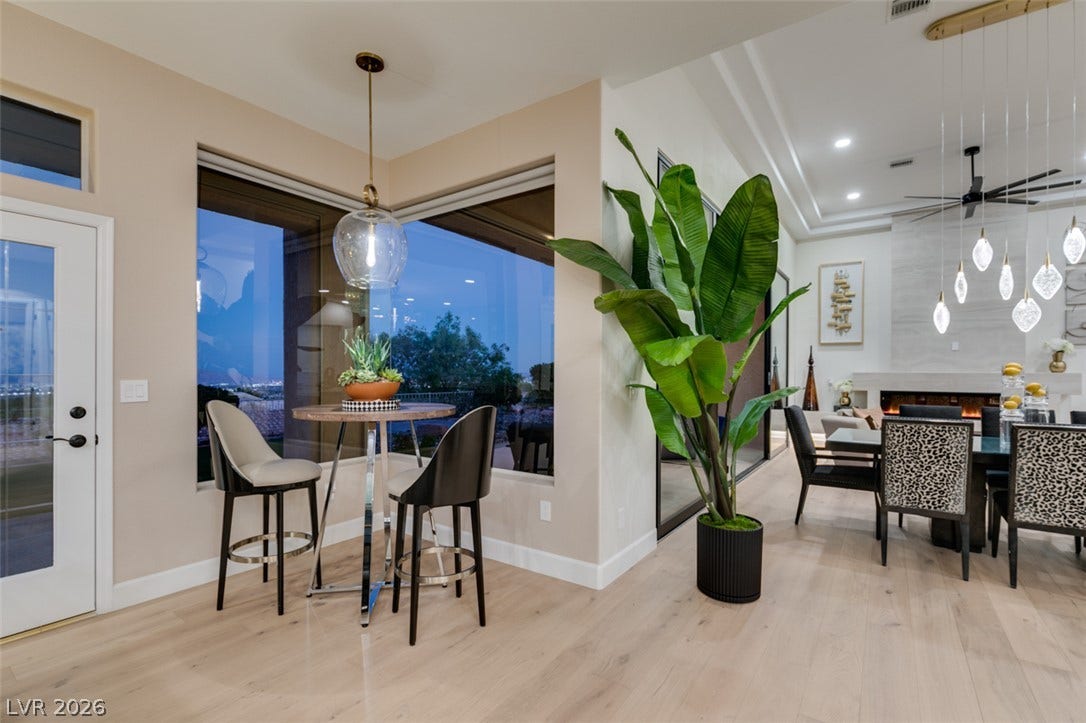2532 Faiss Drive, Las Vegas, NV 89134 Gleaming wood floors run through an open layout framed by massive view-filled windows.