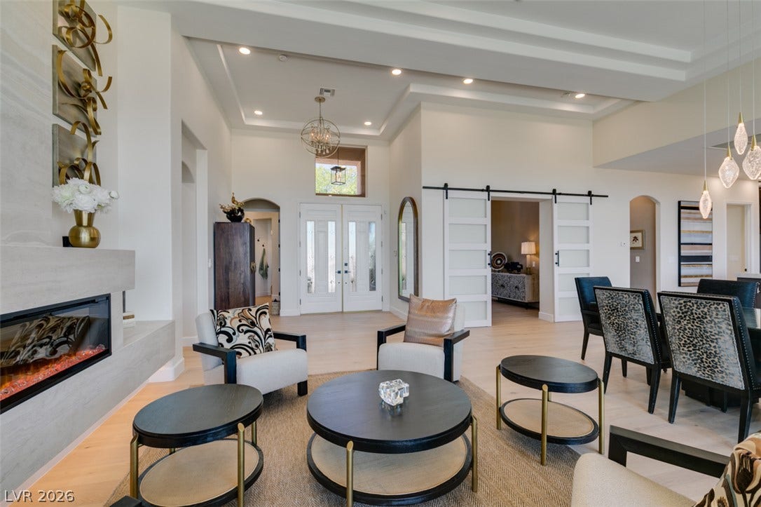 2532 Faiss Drive, Las Vegas, NV 89134 Architectural details define this spacious interior with tray ceilings and a modern fireplace.