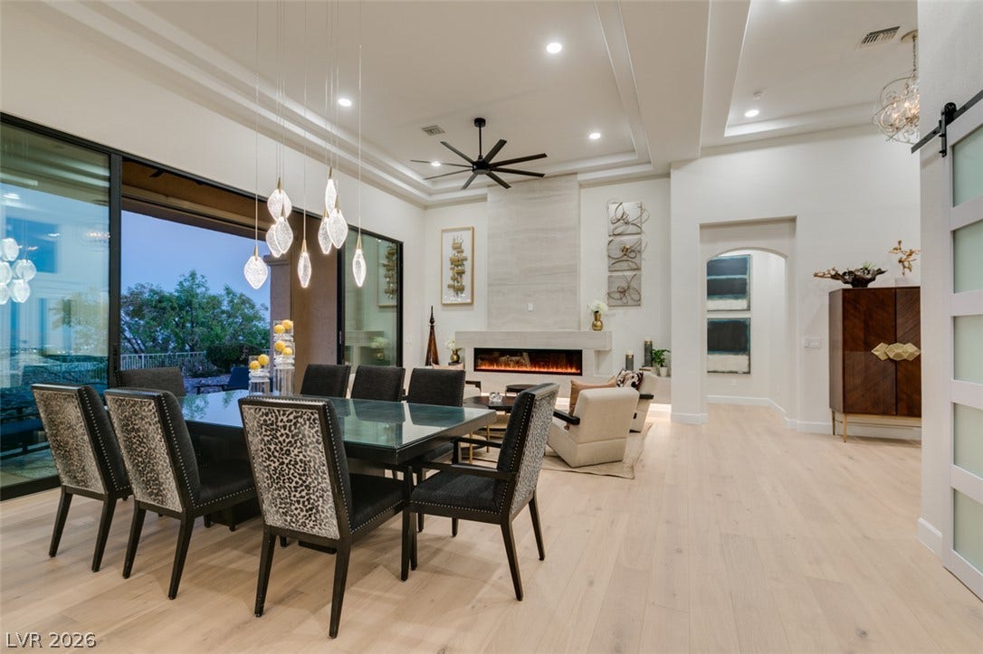 2532 Faiss Drive, Las Vegas, NV 89134 An open floorplan seamlessly connects the dining space to the living area with hardwood floors.
