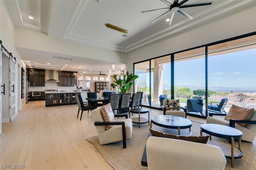 2532 Faiss Drive, Las Vegas, NV 89134 Massive sliding glass walls open this airy great room to sweeping desert vistas.