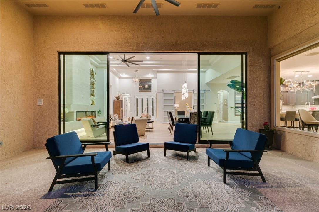 2532 Faiss Drive, Las Vegas, NV 89134 Sliding glass doors establish a seamless connection between the sheltered patio and the open interior.