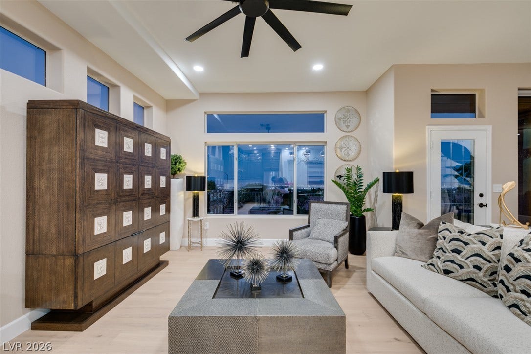 2532 Faiss Drive, Las Vegas, NV 89134 Sunlight streams through large clerestory windows onto light hardwood floors in this airy living space.