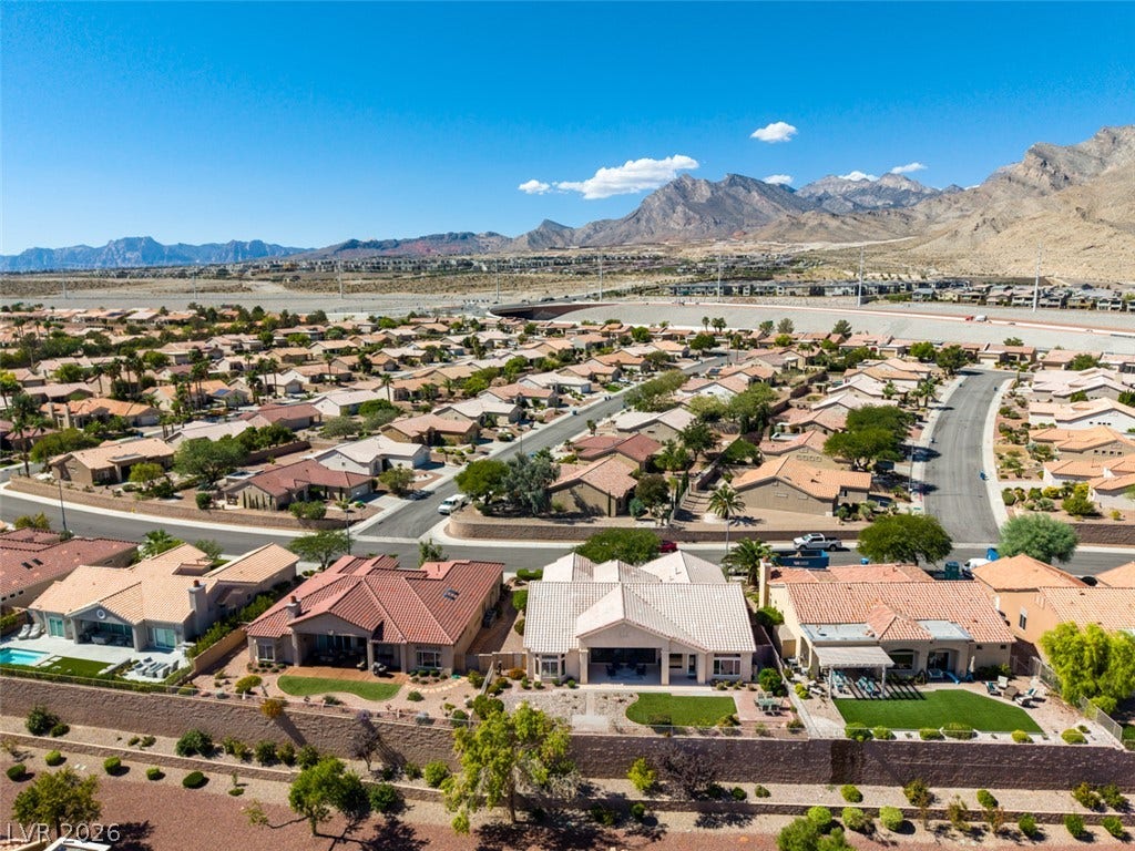 2532 Faiss Drive, Las Vegas, NV 89134 Commanding mountain views overlook a quiet residential enclave of tile-roofed homes.