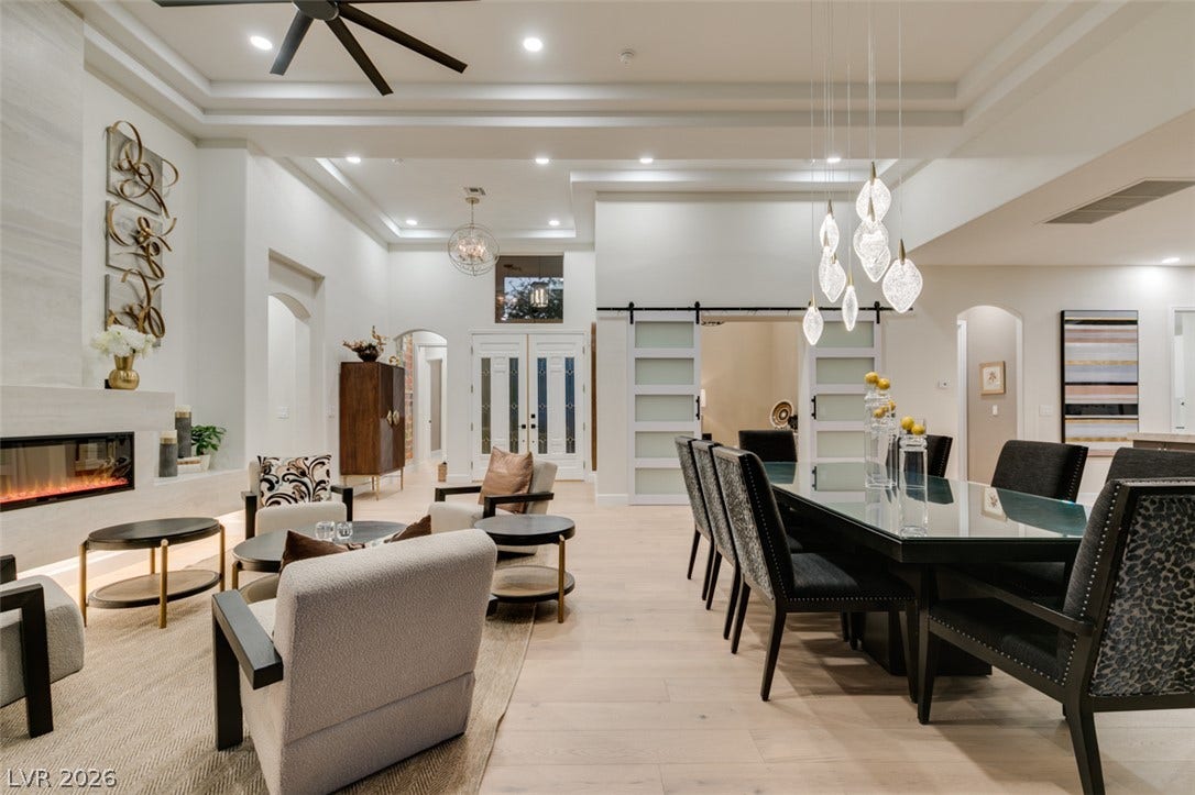 2532 Faiss Drive, Las Vegas, NV 89134 An open floorplan seamlessly connects the dining space and living area under high tray ceilings.