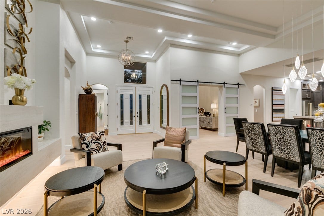 2532 Faiss Drive, Las Vegas, NV 89134 Gleaming wood floors and a contemporary linear fireplace anchor this open concept design.