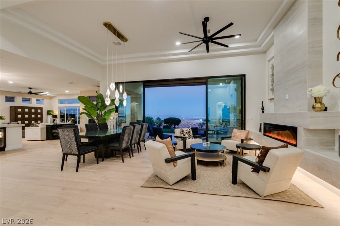 2532 Faiss Drive, Las Vegas, NV 89134 Retracting glass doors open this great room to sweeping twilight views beyond.