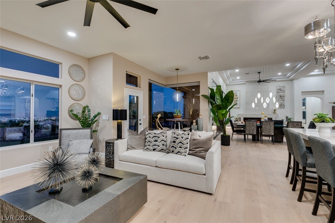 2532 Faiss Drive, Las Vegas, NV 89134 Gleaming hardwood floors and expansive windows anchor this open-concept main level.