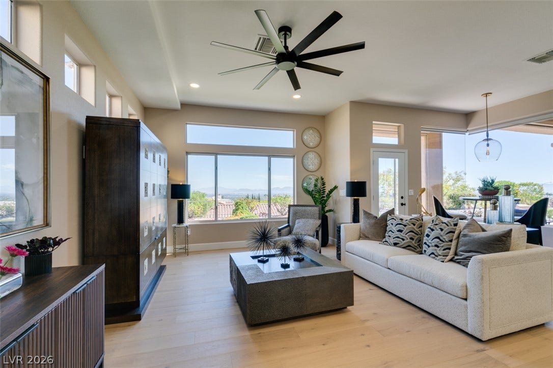 2532 Faiss Drive, Las Vegas, NV 89134 Hardwood floors and oversized windows define this airy, open-concept living space.