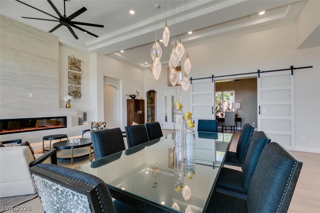 2532 Faiss Drive, Las Vegas, NV 89134 Gleaming wood floors and a tray ceiling define this open, airy dining space.
