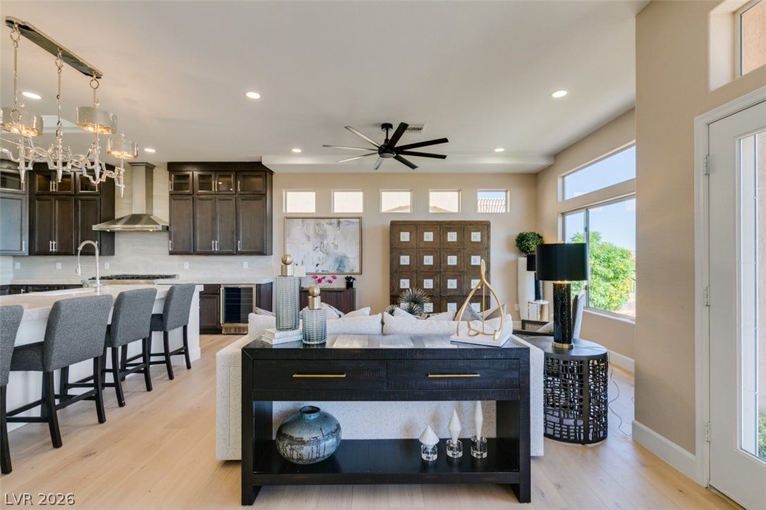 2532 Faiss Drive, Las Vegas, NV 89134 Hardwood floors and high ceilings elevate this flowing, light-filled open concept living area.