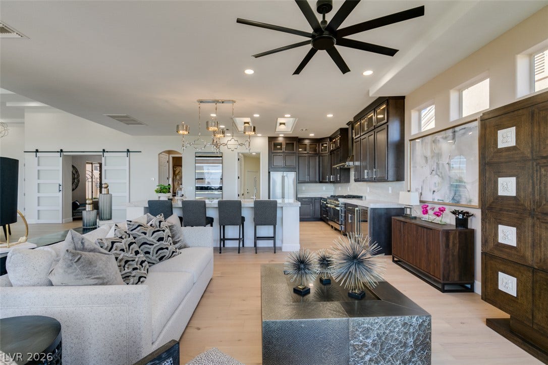 2532 Faiss Drive, Las Vegas, NV 89134 An open floorplan seamlessly connects the airy living area to a modern kitchen.