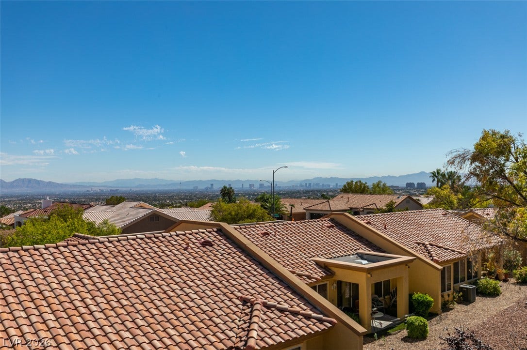 2532 Faiss Drive, Las Vegas, NV 89134 Sweeping mountain and city skyline views unfold from this elevated neighborhood perspective.