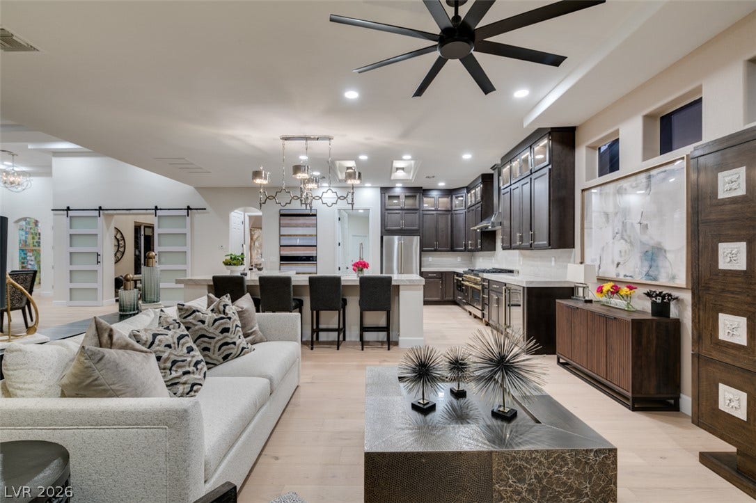 2532 Faiss Drive, Las Vegas, NV 89134 An open floor plan seamlessly connects the comfortable living space to a modern kitchen.