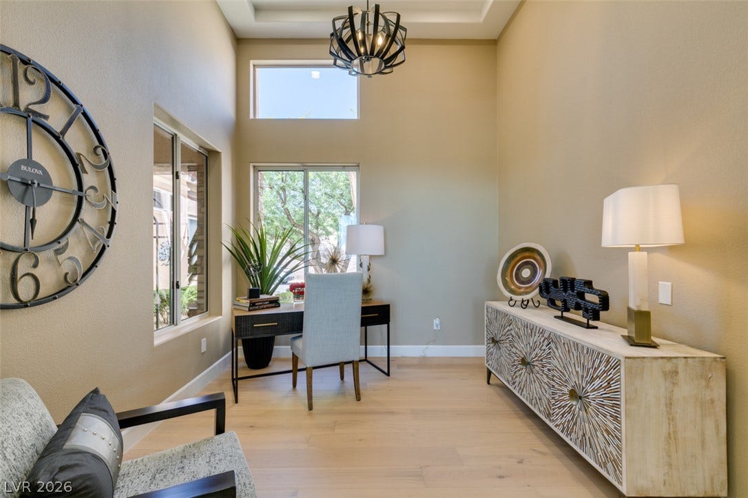 2532 Faiss Drive, Las Vegas, NV 89134 High ceilings and clean wood-plank flooring define this versatile home office space.