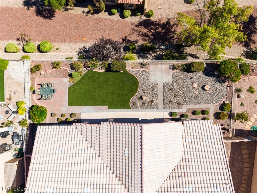 2532 Faiss Drive, Las Vegas, NV 89134 Manicured landscaping and paved pathways define this carefully structured backyard retreat.