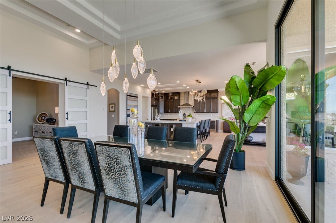 2532 Faiss Drive, Las Vegas, NV 89134 Gleaming wood floors and a tray ceiling define this open, airy dining space.