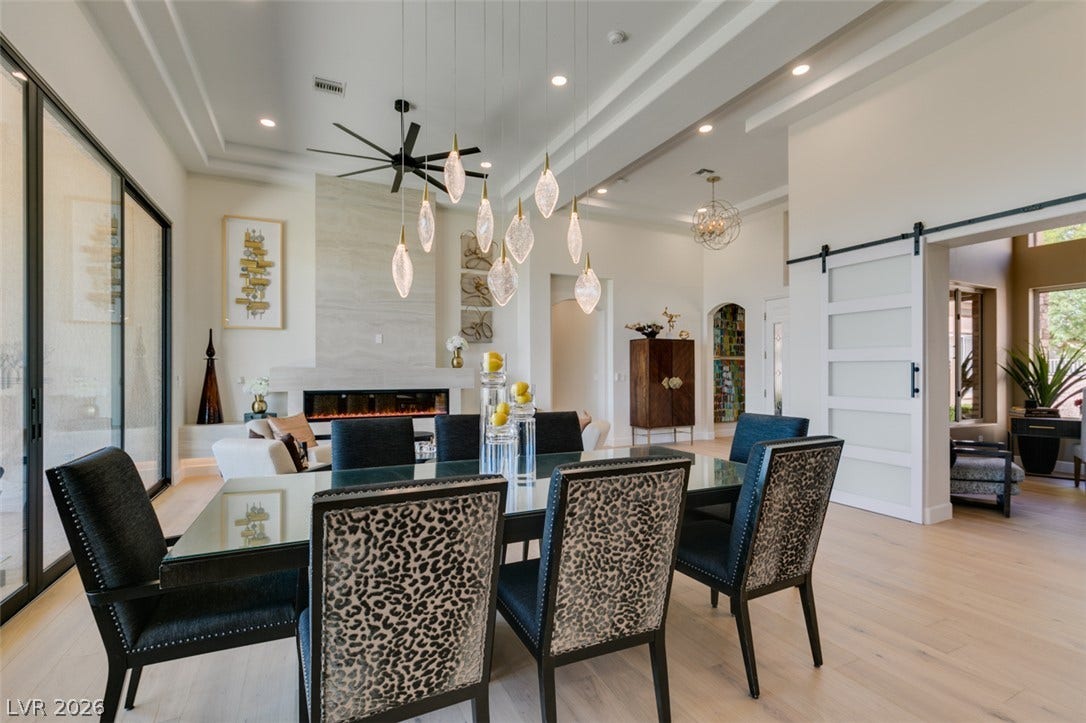 2532 Faiss Drive, Las Vegas, NV 89134 Gleaming wood floors and a tray ceiling define this open, airy dining space.