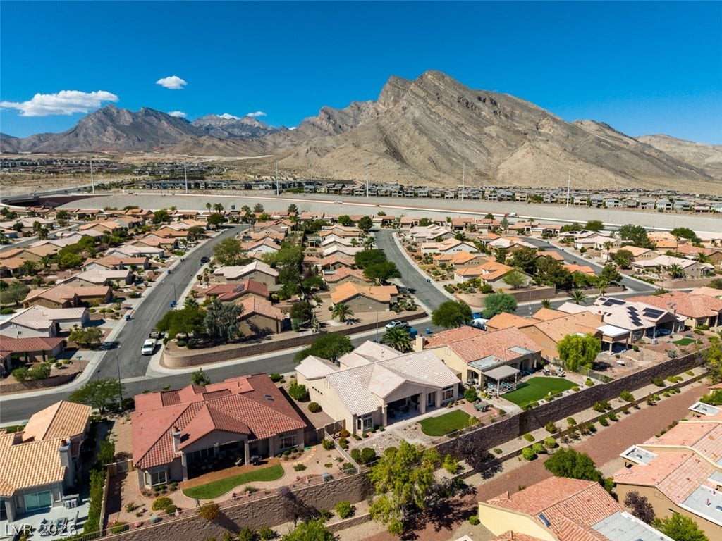 2532 Faiss Drive, Las Vegas, NV 89134 Dramatic mountain peaks provide a majestic backdrop to this quiet suburban neighborhood.