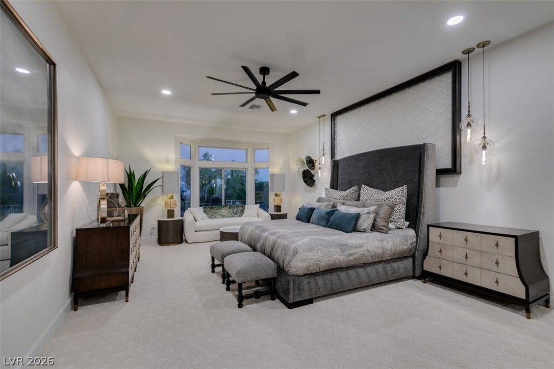 2532 Faiss Drive, Las Vegas, NV 89134 A spacious bedroom features plush carpeting, recessed lighting, and a large bay window.