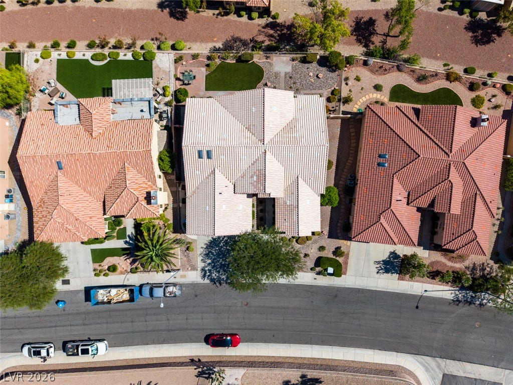 2532 Faiss Drive, Las Vegas, NV 89134 An aerial perspective showcases the tiled roofs and manicured desert landscaping of this neighborhood.