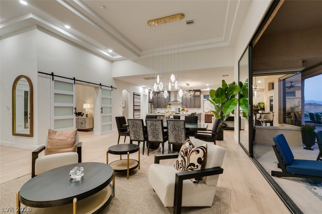 2532 Faiss Drive, Las Vegas, NV 89134 Recessed lighting and detailed ceilings crown this airy open-concept living and dining area.