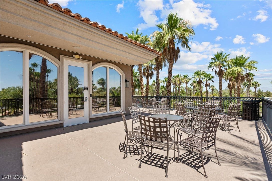 8175 Arville Street, #186, Las Vegas, NV 89139 A spacious elevated patio overlooks a scenic vista framed by mature palm trees.