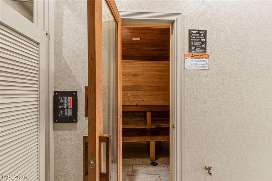 8175 Arville Street, #186, Las Vegas, NV 89139 Rich wood paneling and tiered bench seating define this relaxing private home sauna.