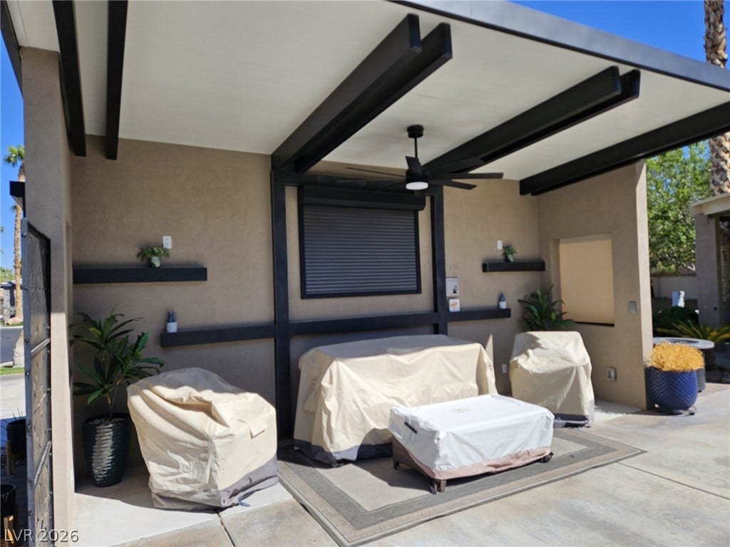 8175 Arville Street, #186, Las Vegas, NV 89139 An inviting covered patio area displays bold architectural beams and a smooth concrete floor.
