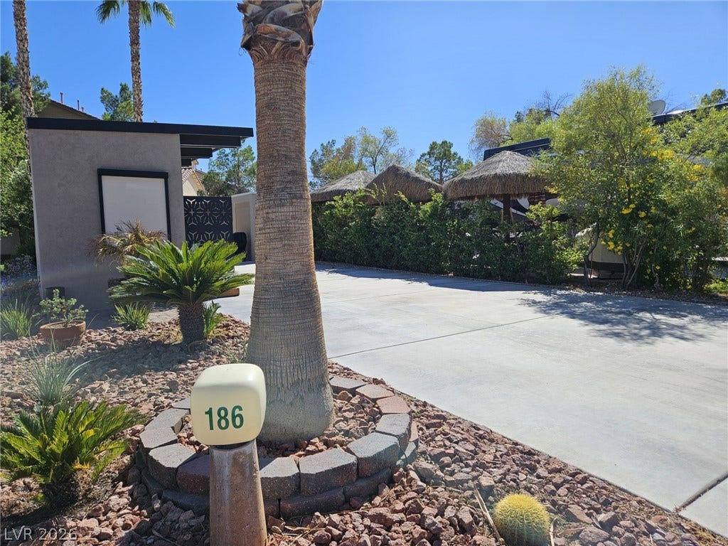 8175 Arville Street, #186, Las Vegas, NV 89139 Lush desert plantings and a paved driveway create an inviting entrance to this property.