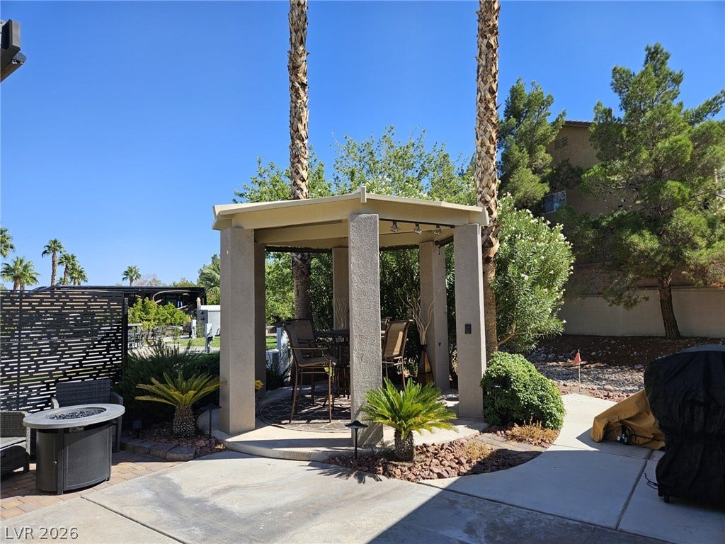 8175 Arville Street, #186, Las Vegas, NV 89139 An inviting covered gazebo stands adjacent to a spacious concrete patio under clear blue skies.