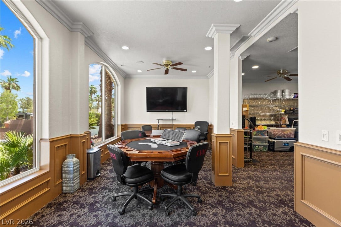 8175 Arville Street, #186, Las Vegas, NV 89139 Elegant crown molding and classic wainscoting frame this versatile recreation space.