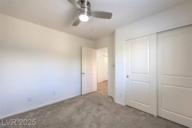 4134 San Cuervo Way, Las Vegas, NV 89115 Plush carpeting anchors this versatile room featuring sliding closet doors.