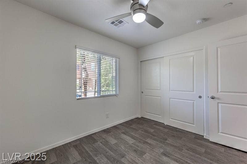 4134 San Cuervo Way, Las Vegas, NV 89115 Smooth wood-look flooring and a classic multi-panel sliding closet doors define this versatile space.