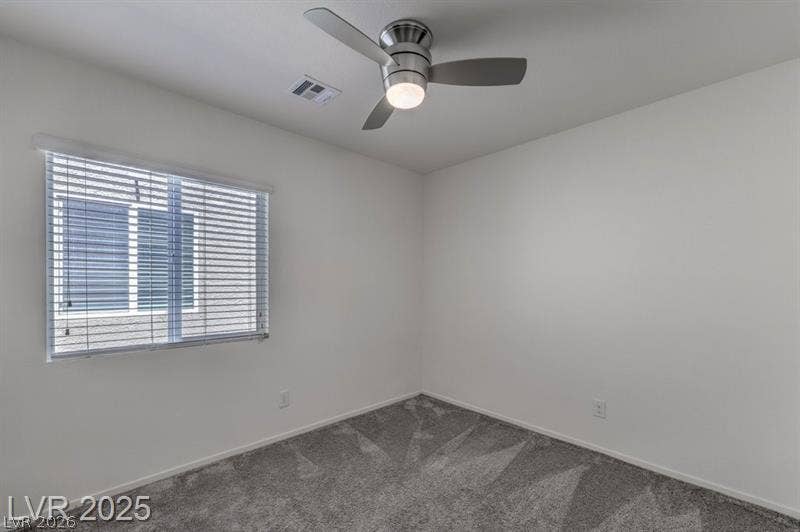 4134 San Cuervo Way, Las Vegas, NV 89115 Plush wall-to-wall carpeting and a wide window with integrated blinds enhance this versatile bedroom.