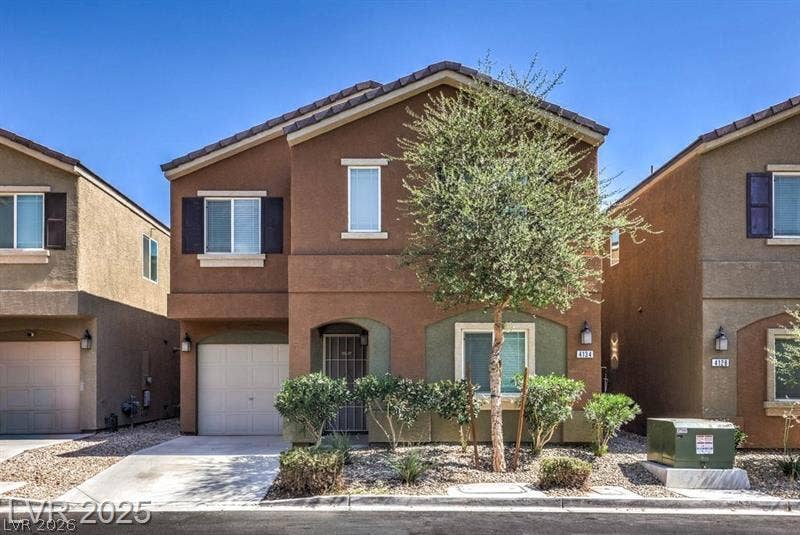 4134 San Cuervo Way, Las Vegas, NV 89115 Tuscan-style architecture defines this multi-level home featuring an attached garage and desert-friendly landscaping.