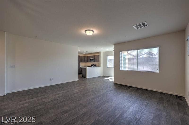 4134 San Cuervo Way, Las Vegas, NV 89115 An open floorplan seamlessly connects the primary living space to the adjacent kitchen area.