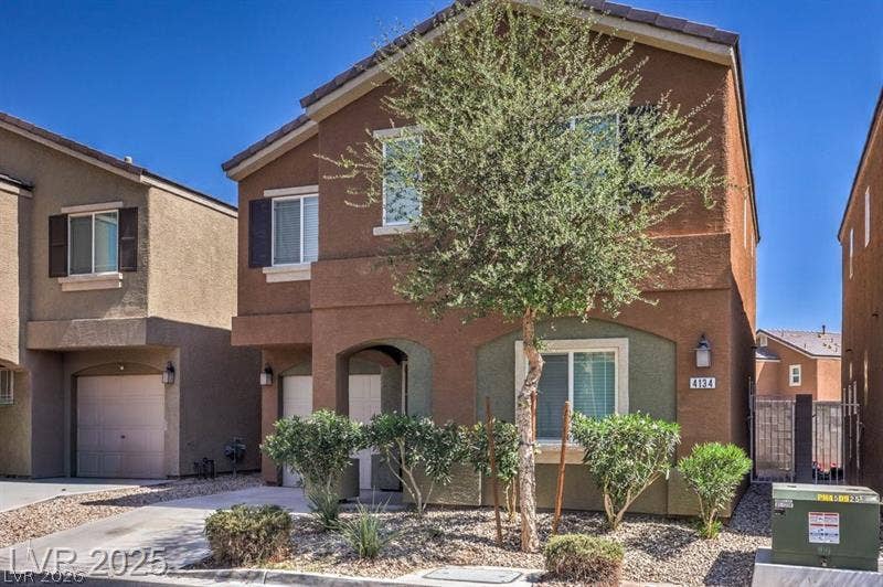 4134 San Cuervo Way, Las Vegas, NV 89115 A classic tiled roof and arched entryway define this multi-level home.