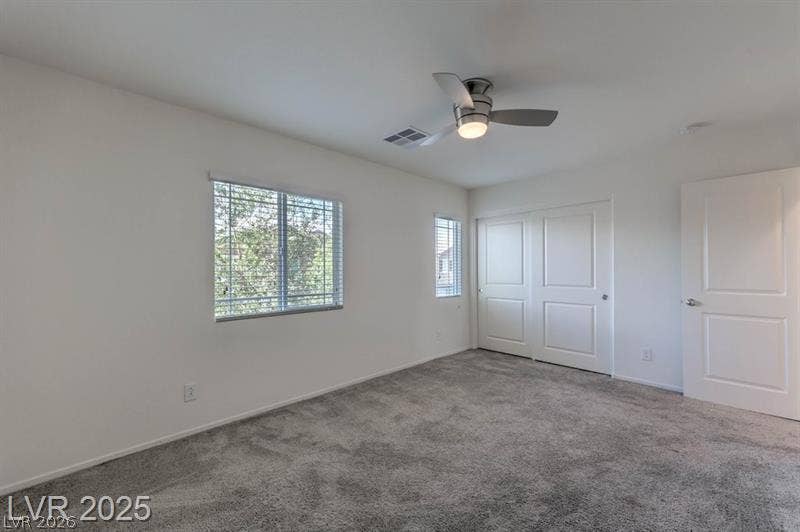 4134 San Cuervo Way, Las Vegas, NV 89115 Soft carpeting pairs with neutral walls in this comfortable secondary bedroom.